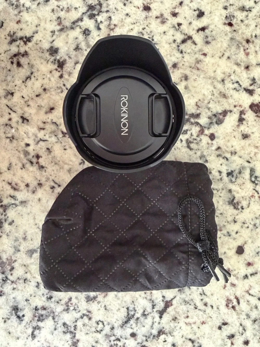 Rokinon 12mm F2 manual focus lens, with hood, and Drawstring Pouch. Sony E mount